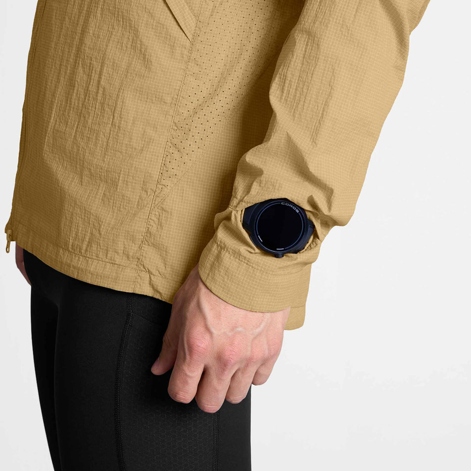 The watch window on the sleeve of the SAYSKY Men's Pace Tech Jacket in the Beige colourway.