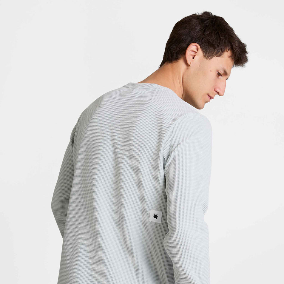 Back view of a model wearing the SAYSKY Men's Motion Waffle Long Sleeve in the Grey colourway.