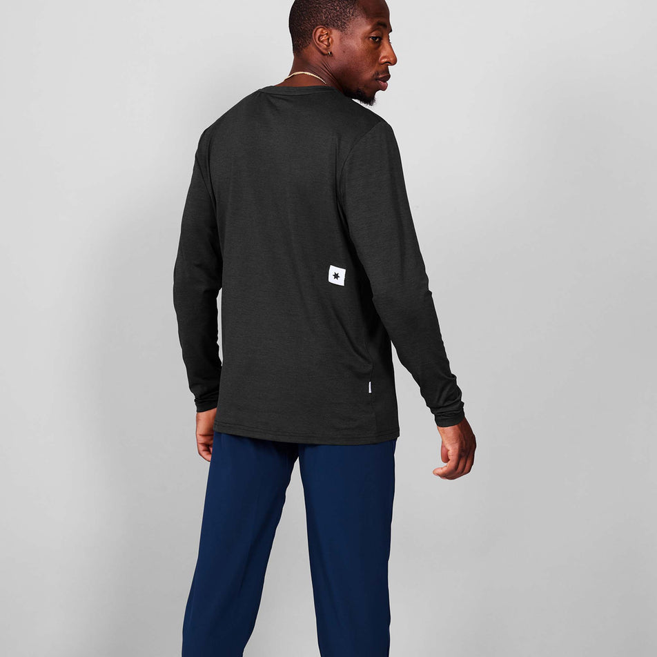 Back view of a model wearing the SAYSKY Men's Clean Pace Long Sleeve in the Black-26 colourway.