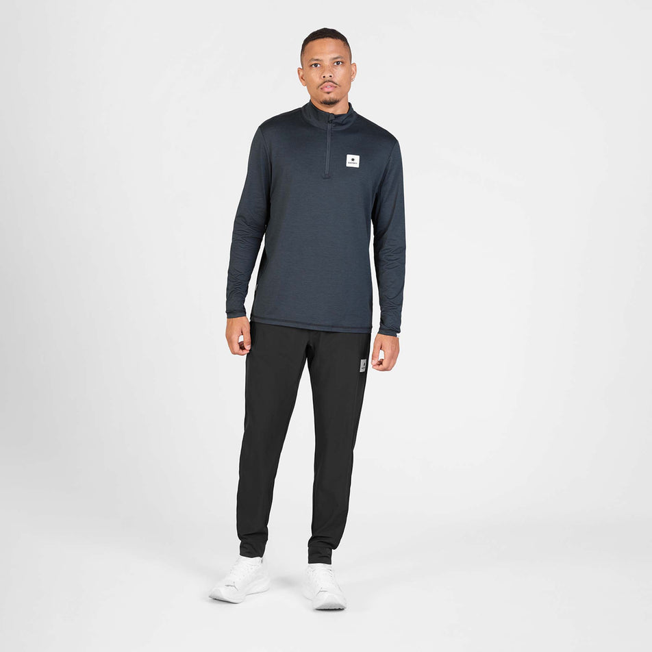 Front view of a model wearing the SAYSKY Men's Pace Half Zip Long Sleeve in the  Black colourway.
