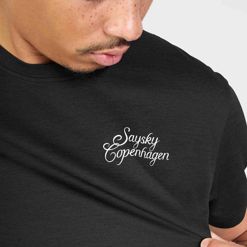 Close-up view of the chest logo on the SAYSKY Men's Statement Combat Pro T-Shirt in the Black colourway.