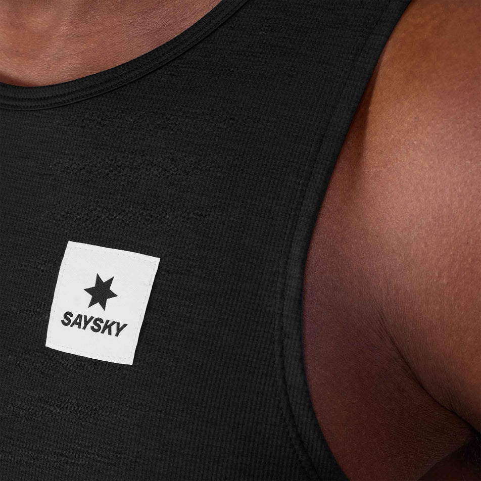 Close-up view of the SAYSKY logo on the front of the SAYSKY Men's Clean Combat Pro Singlet in the Black colourway.