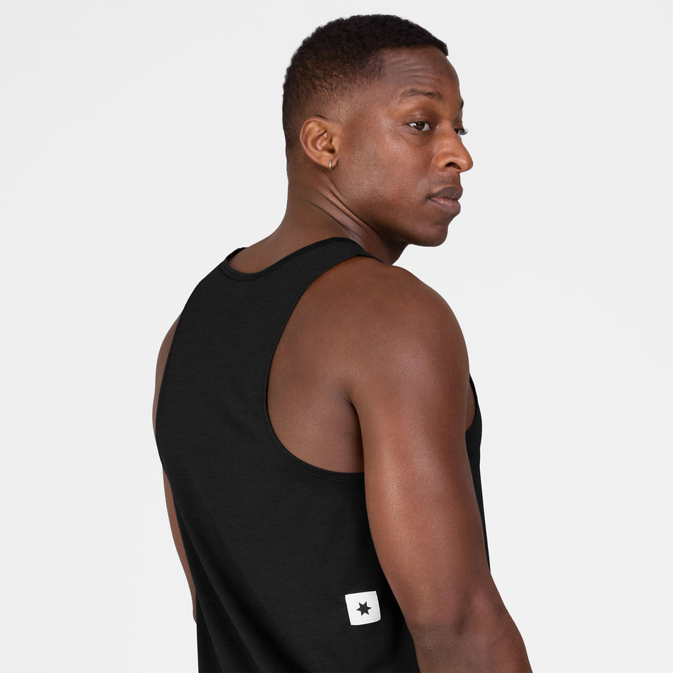 Back view of a model wearing the SAYSKY Men's Clean Combat Pro Singlet in the Black colourway.