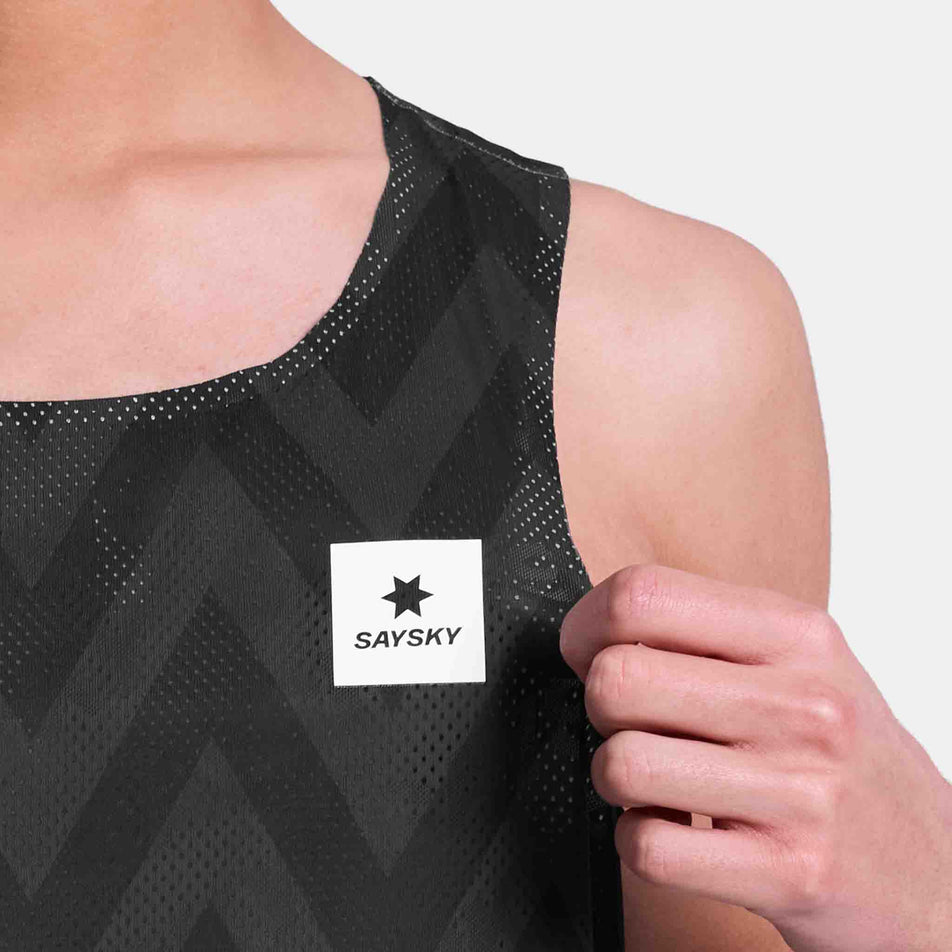 Close-up view of the SAYSKY logo on the SAYSKY Men's Zig Zag Flow Air Singlet in the Black Zig Zag colourway.