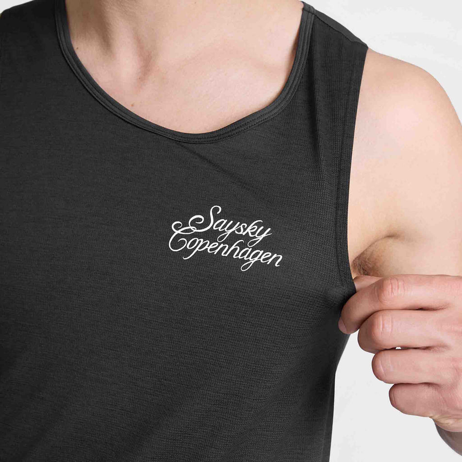 Close-up view of the logo on the chest of the SAYSKY Men's Statement Combat Pro Singlet in the Black colourway.