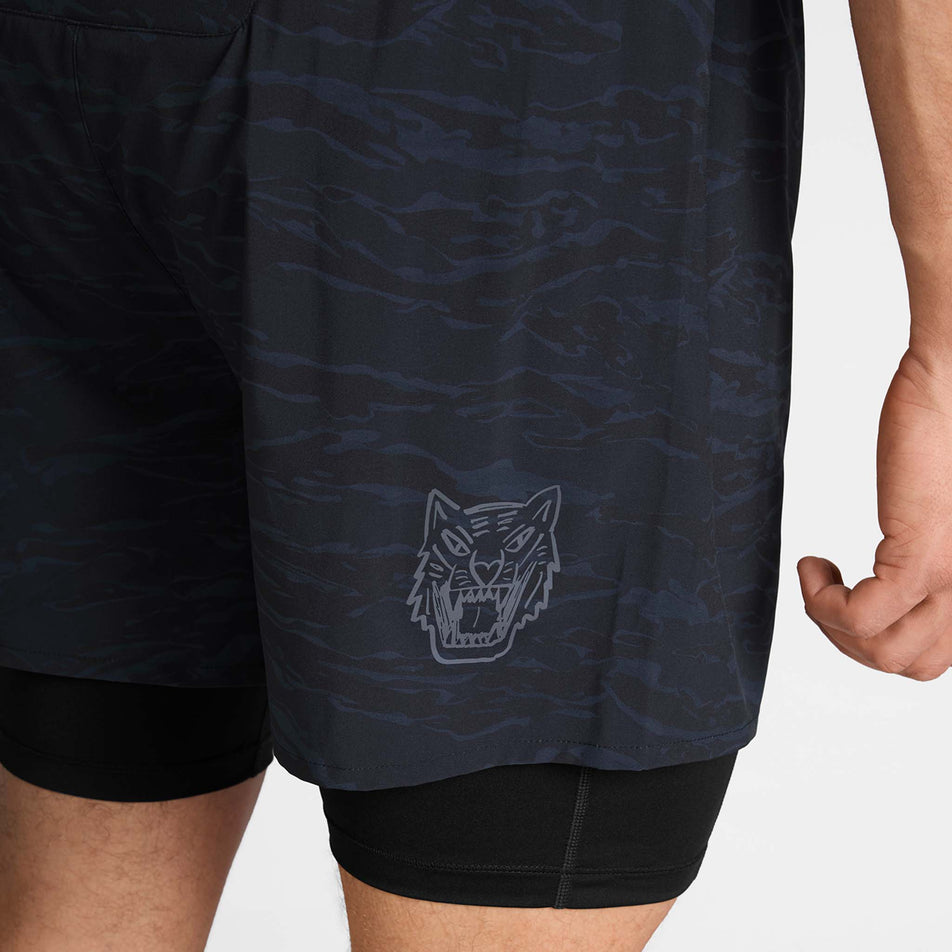 Close-up view of the tiger graphic on the back of the SAYSKY Men's Tiger Pace 2 In 1 Shorts 5