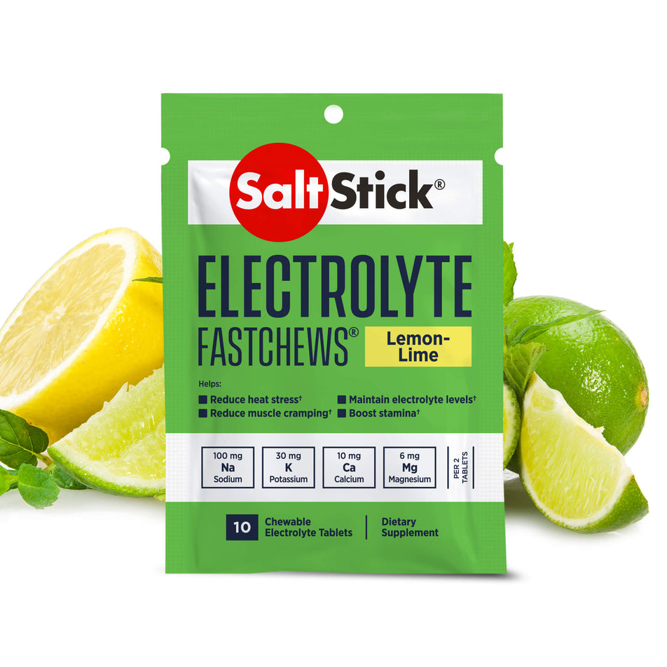 A packet of SaltStick Fast Chews in the Lemon & Lime flavour; with images of lemon and limes in the background, behind the packet. (8218223935650)