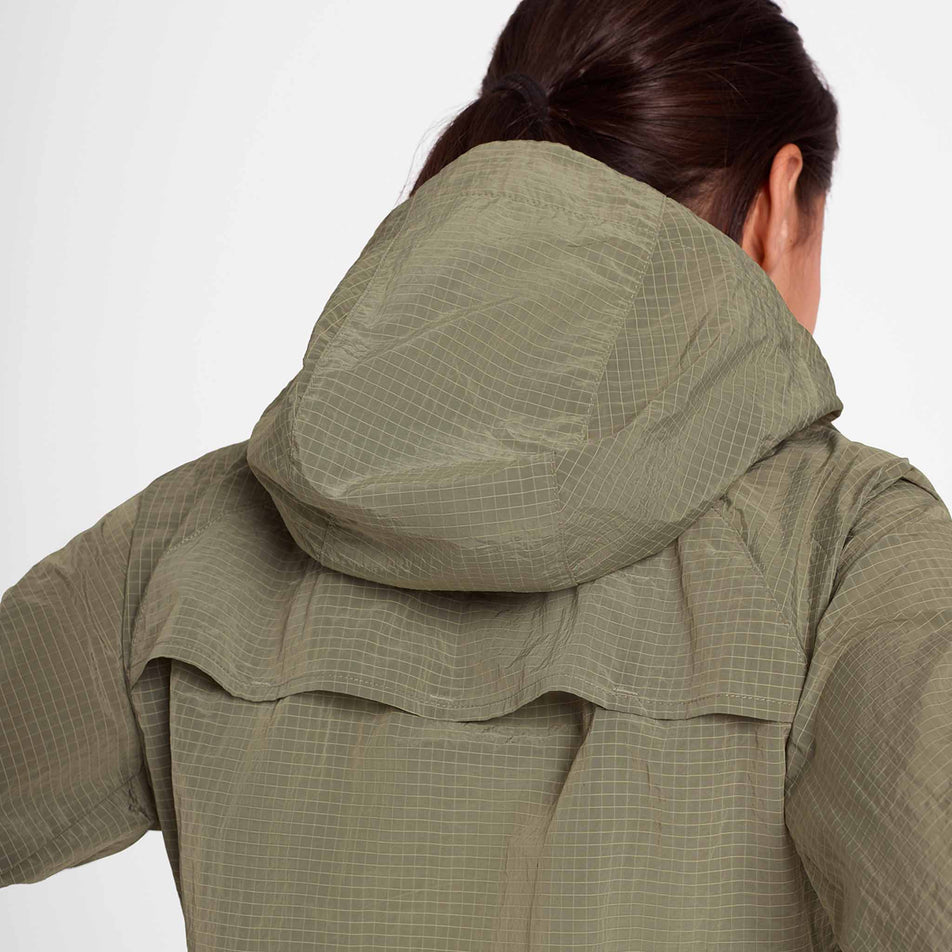 Back view of a model wearing the SAYSKY Women's Clean Pace Shield Jacket in the Beige colourway.