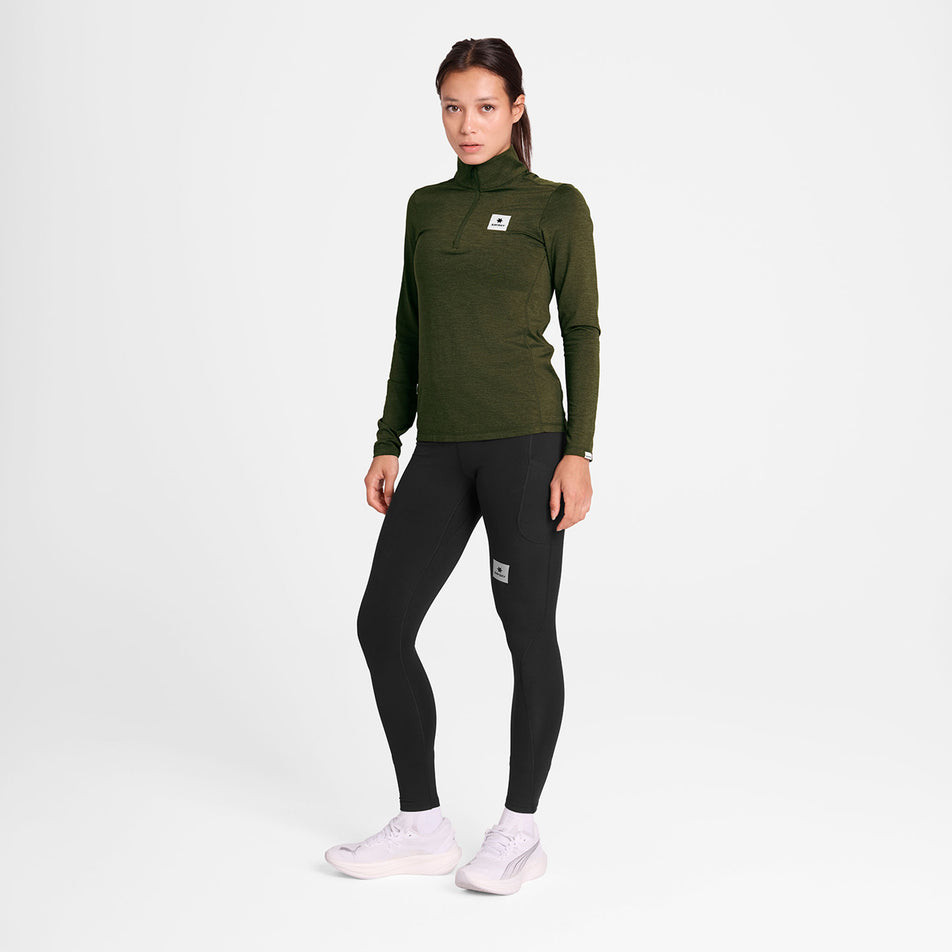 Front view of a model wearing the SAYSKY Women's Pace 1/2 Zip Long Sleeve in the Green colourway.