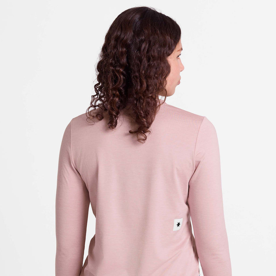 Back view of a model wearing the SAYSKY Women's Clean Pace Long Sleeve in the Pink colourway.