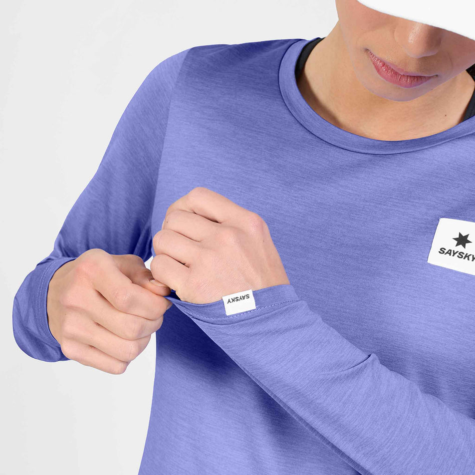 Front view of a model wearing the SAYSKY Women's Clean Pace Long Sleeve in the Purple colourway.