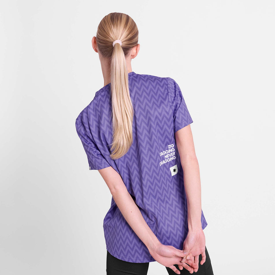 Back view of a model wearing the SAYSKY Women's Zig Zag Combat T-Shirt in the Purple Zig Zag colourway.