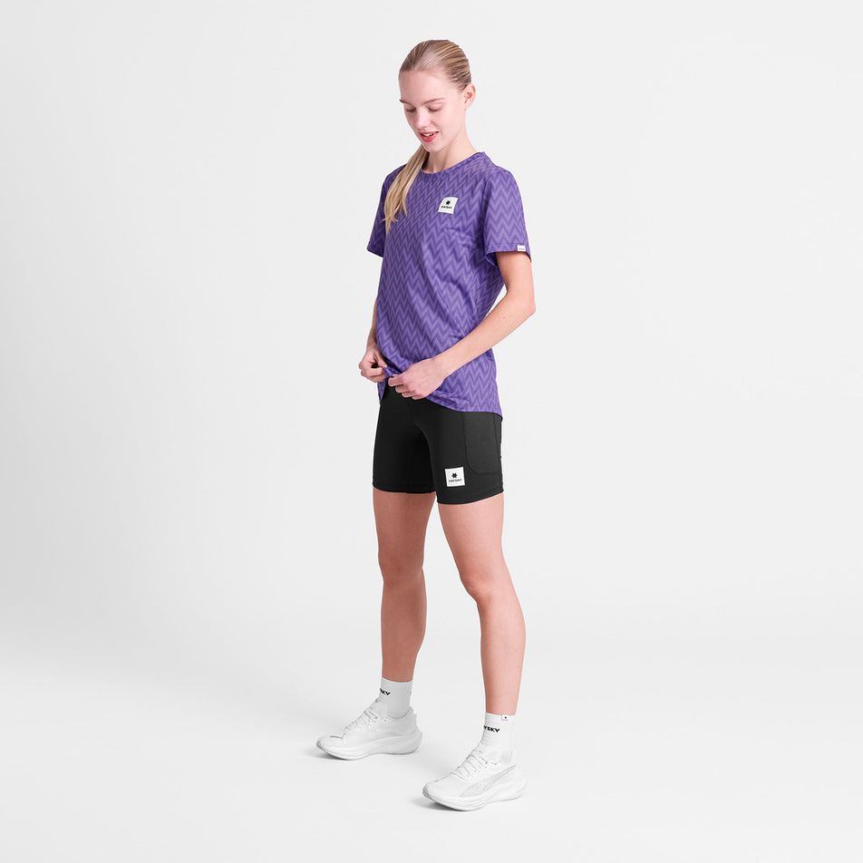 Angled view of a model wearing the SAYSKY Women's Zig Zag Combat T-Shirt in the Purple Zig Zag colourway.