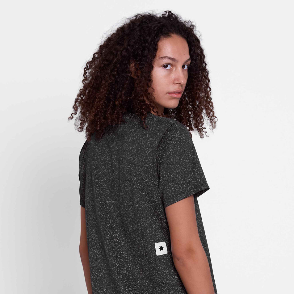 Back view of a model wearing the SAYSKY Women's Universe Combat T-Shirt in the Black Universe colourway.
