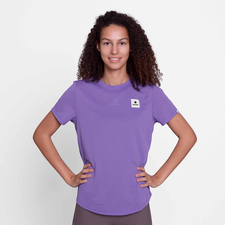 Front view of a model wearing the SAYSKY Women's Universe Combat T-Shirt in the Purple Universe colourway.