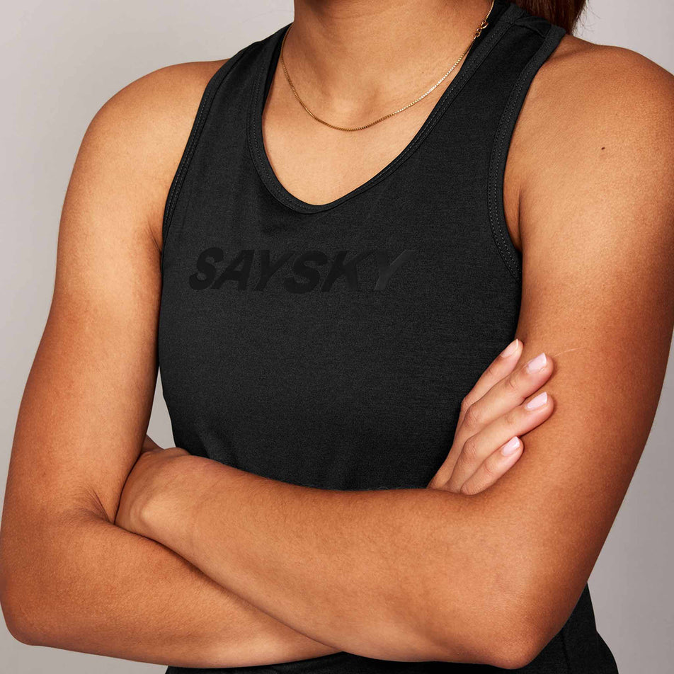 Front view of a model wearing the SAYSKY Women's Logo Pace Top in the Black colourway.