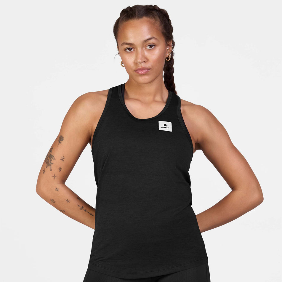 Front view of a model wearing the SAYSKY Women's Clean Combat Pro Singlet in the Black colourway.