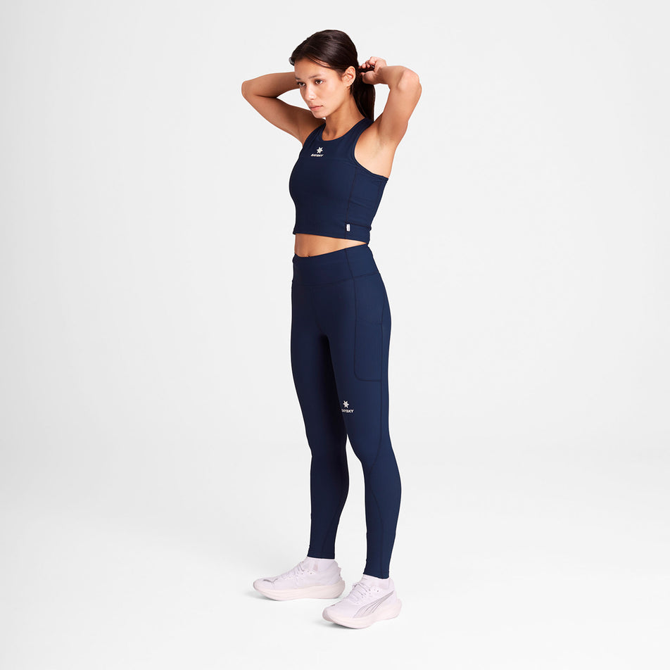 Angled view of a model wearing the SAYSKY Women's Combat Rib Crop Top in the Blue/White colourway.