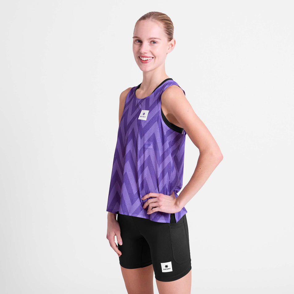 Front view of a model wearing the SAYSKY Women's Zig Zag Flow Air Singlet in the Purple Zig Zag colourway.