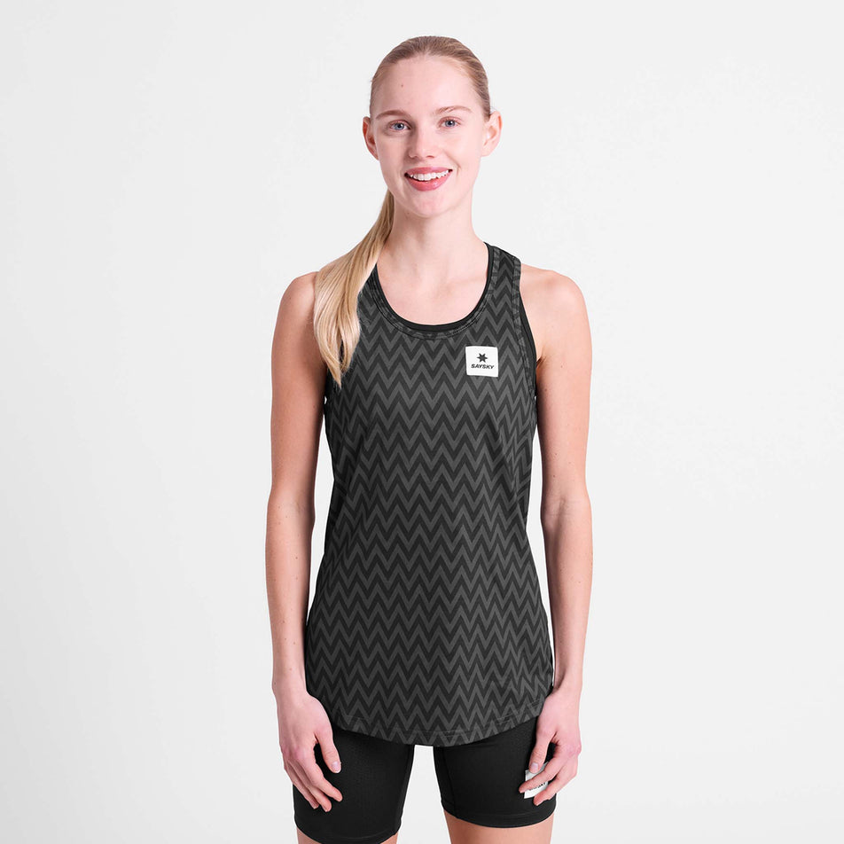 Front view of a model wearing the SAYSKY Women's Zig Zag Combat Singlet in the Black Zig Zag colourway.