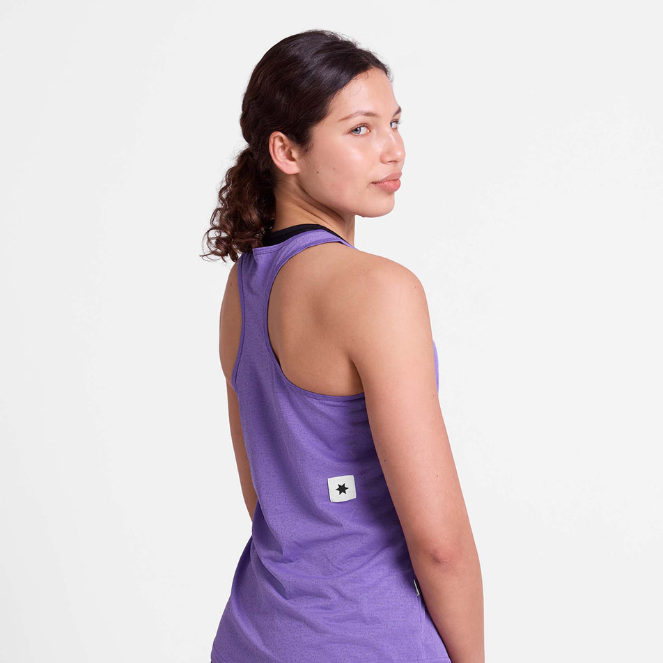 Back view of a model wearing the SAYSKY Women's Universe Combat Singlet in the Purple Universe colourway.