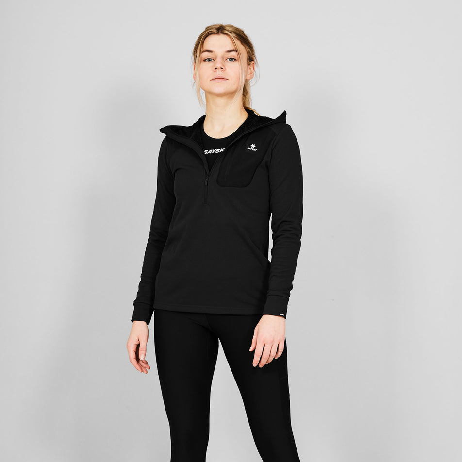 Front view of a model wearing the SAYSKY Combat Half Zip Fleece Hoodie in the Black colourway.