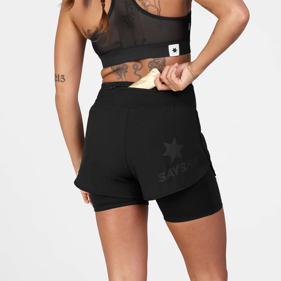 Back view of a model wearing the SAYSKY Women's 2 In 1 Pace Shorts 3