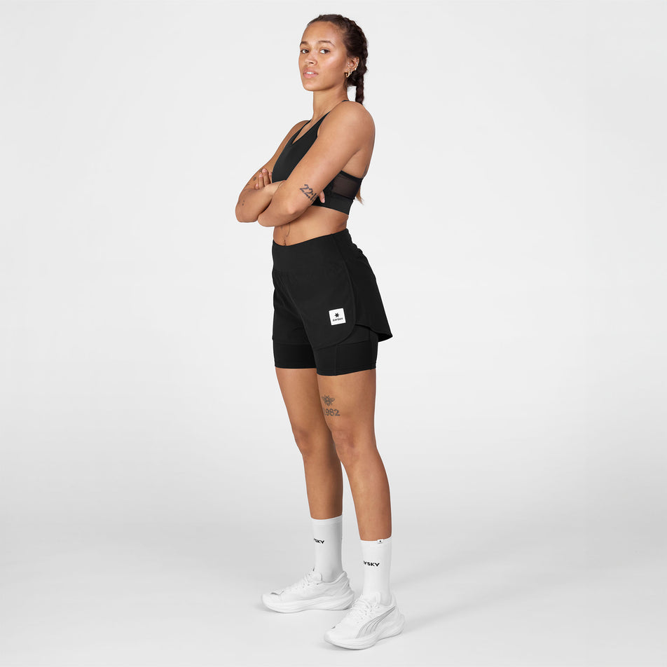 Angled view of a model wearing the SAYSKY Women's 2 In 1 Pace Shorts 3