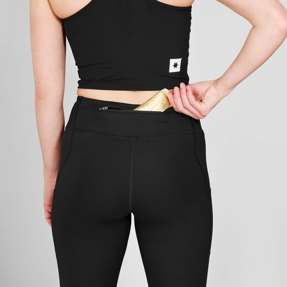 The zip pocket on the back of the SAYSKY Women's Pace+ Long Tights in the Black colourway.