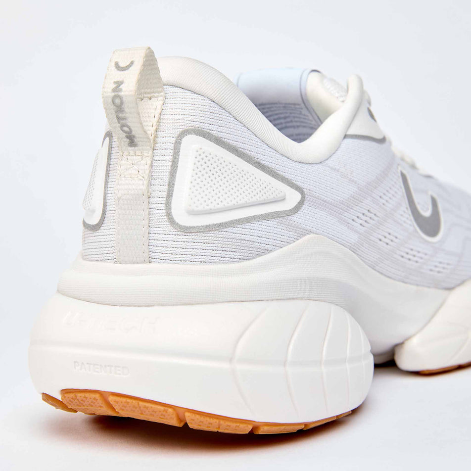 Lateral view of the right shoe from a pair of True Motion Women's U-Tech Nevos 4 Running Shoes in the White/Bright White colourway.