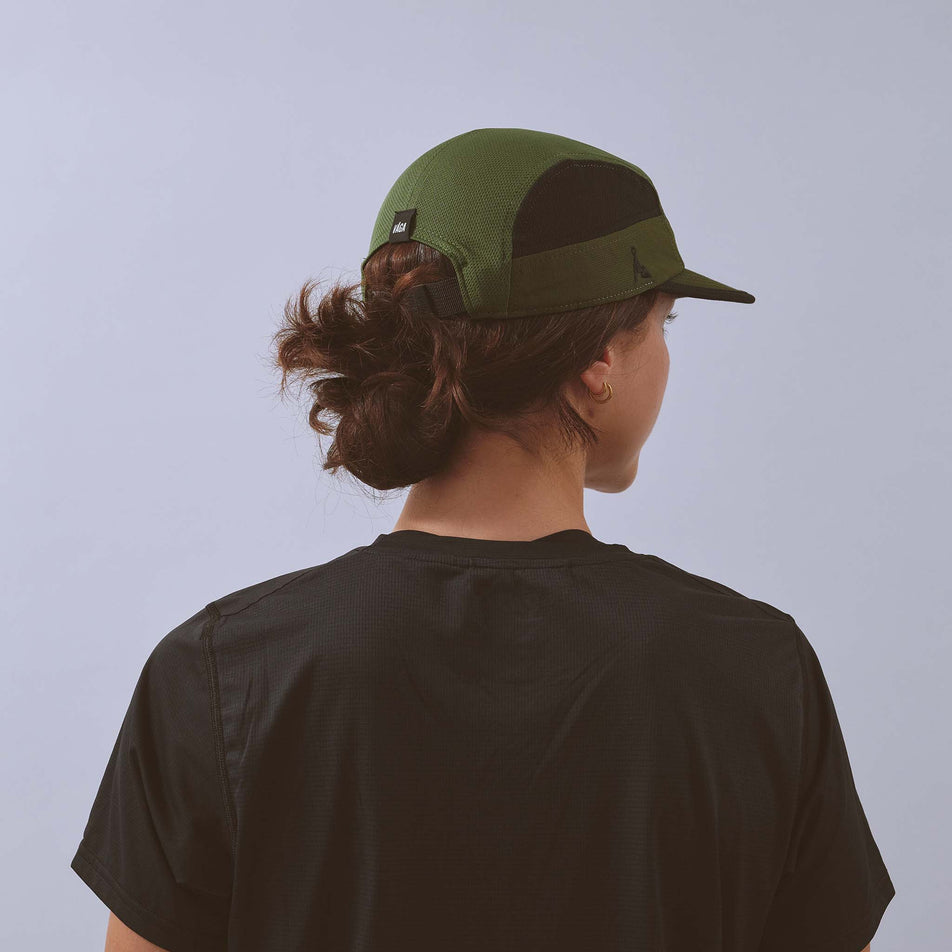 Back view of a model wearing the VAGA Unisex Club Cap in the Utility Green/Black colourway.