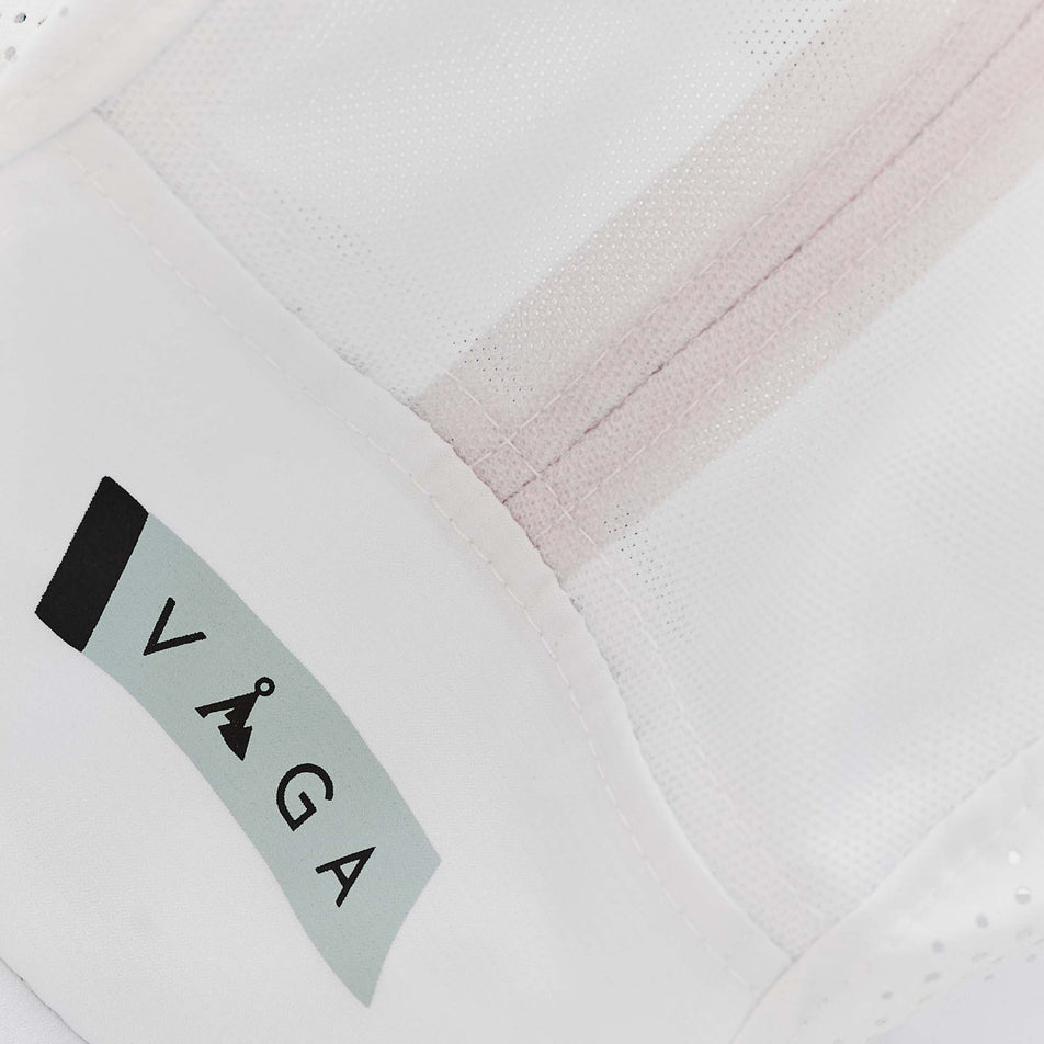 Close-up of the VAGA logo on a VAGA Unisex Feather Racing Cap in the White/Mist Grey/Black colourway (8217277759650)