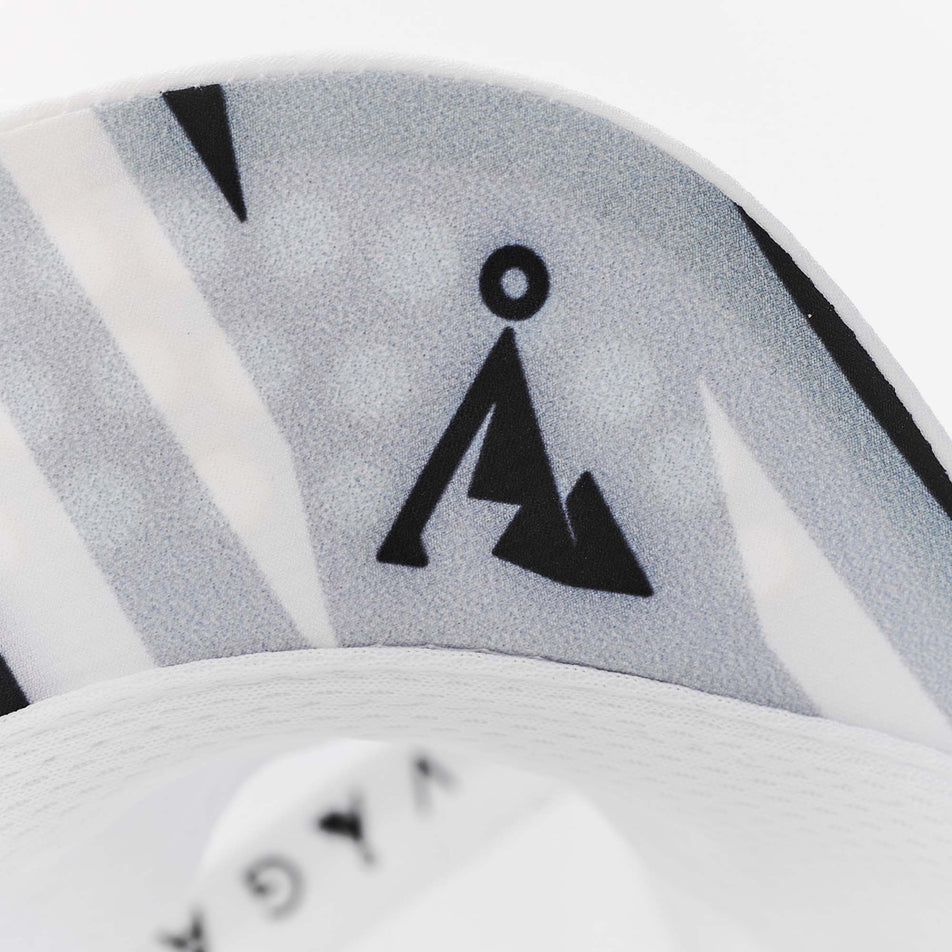 Close-up of a VAGA logo on the underside of the visor on a VAGA Unisex Feather Racing Cap in the White/Mist Grey/Black colourway (8217277759650)