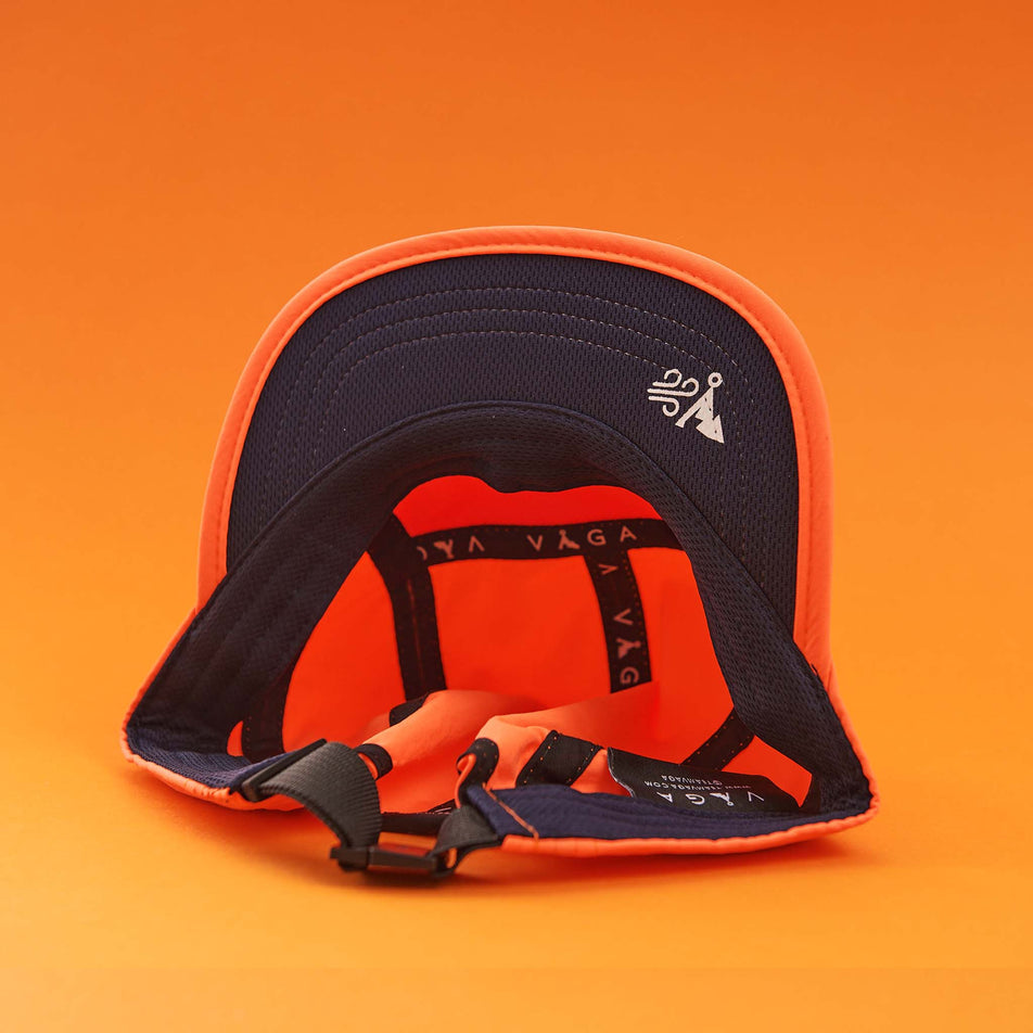 The inside of a VAGA Unisex Fell Cap in the Neon Orange/Navy colourway (8217265307810)