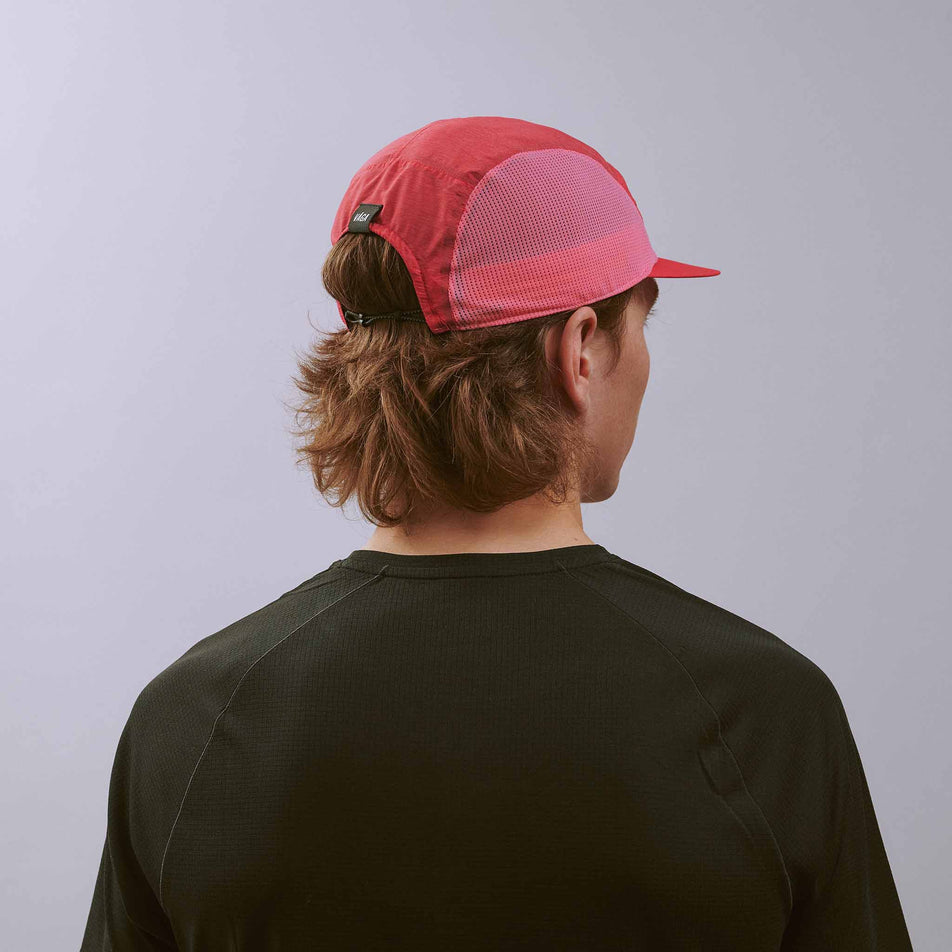 Back view of a model wearing the VÅGA Unisex Mesh Flex Cap in the Dark Pink/Pink colourway.