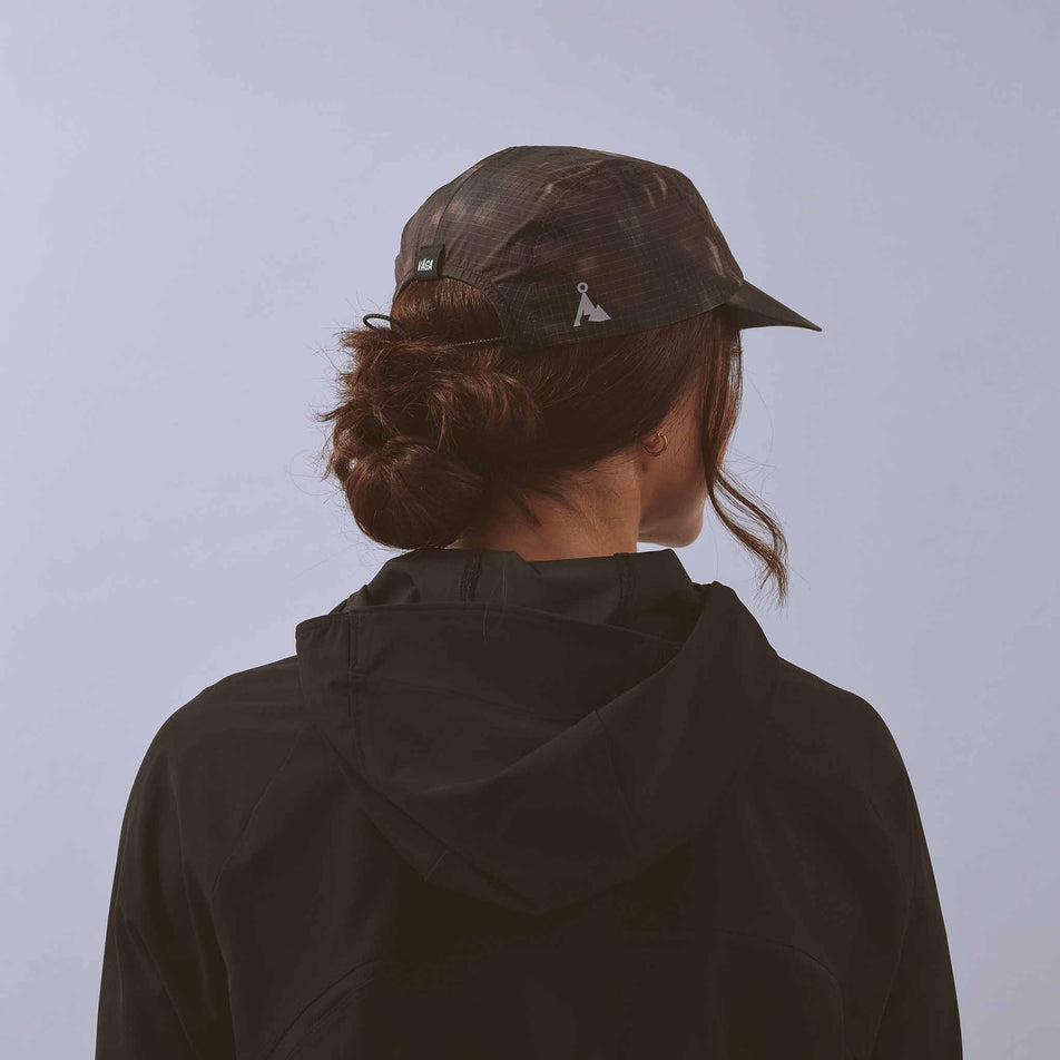Back view of a model wearing the VAGA Unisex Night Club Cap in the Ember colourway.