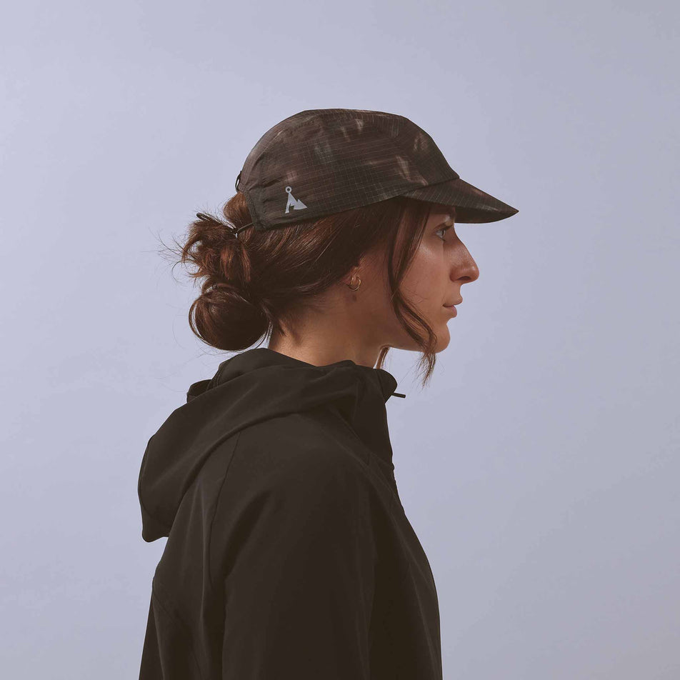 Side view of a model wearing the VAGA Unisex Night Club Cap in the Ember colourway.