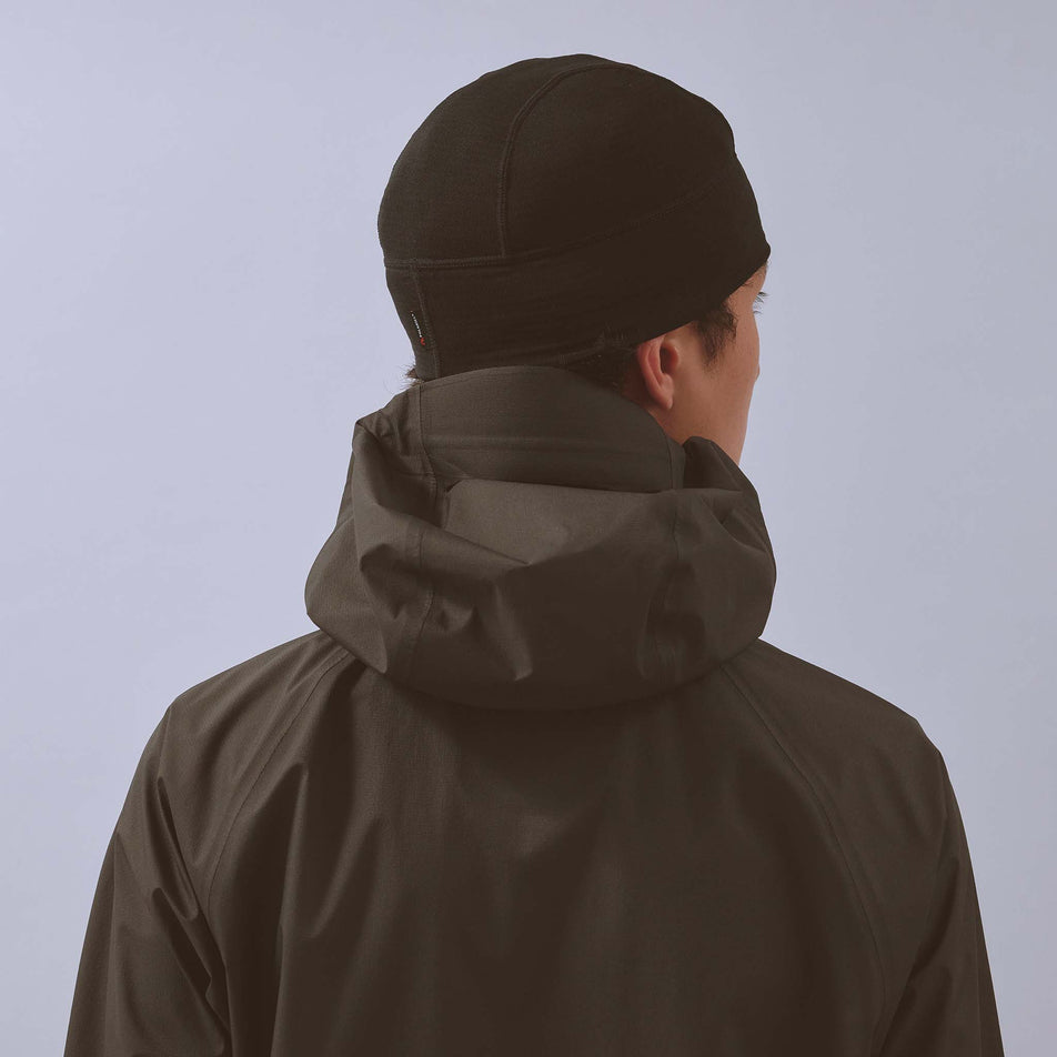 Back view of a model wearing the VAGA Unisex Summit Performance Skull Cap in the Black colourway.