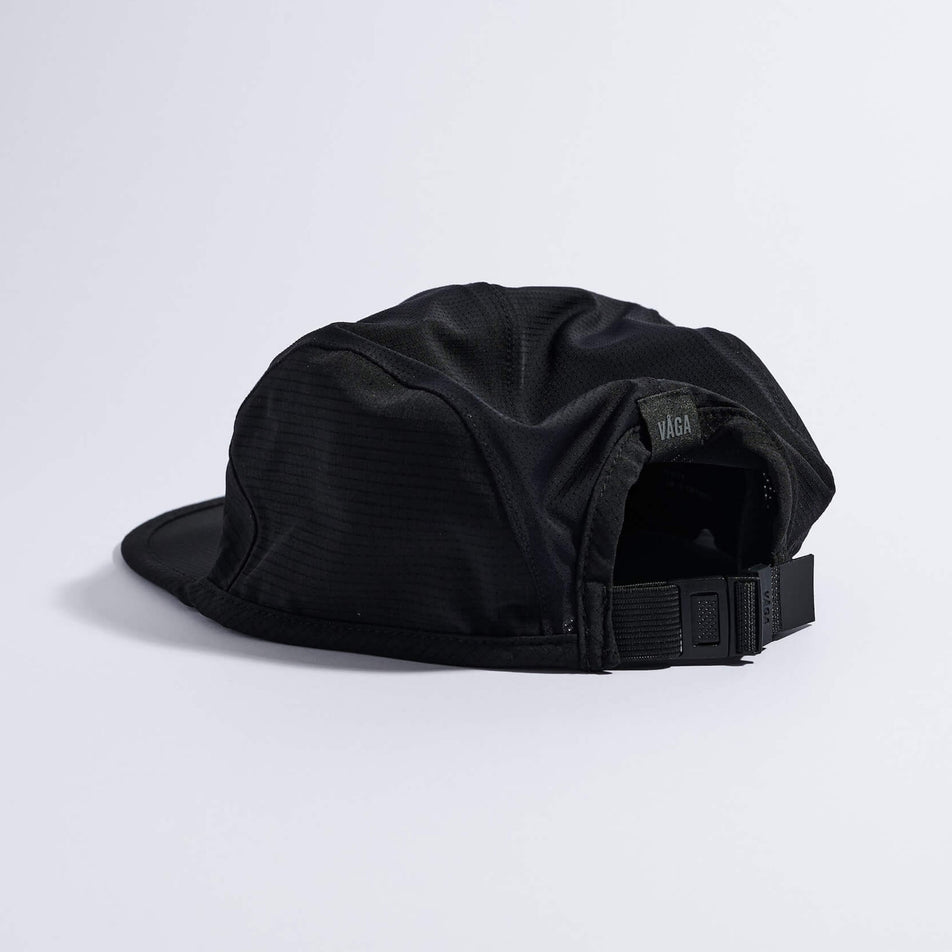 Angled view of the VAGA Unisex Transit Lite Cap in the Black colourway.