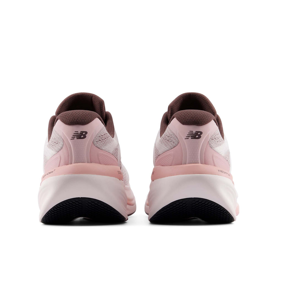 The back of a pair of New Balance Women's Fresh Foam X 860 V15 Running Shoes in the Pink Salt/Pebble colourway.