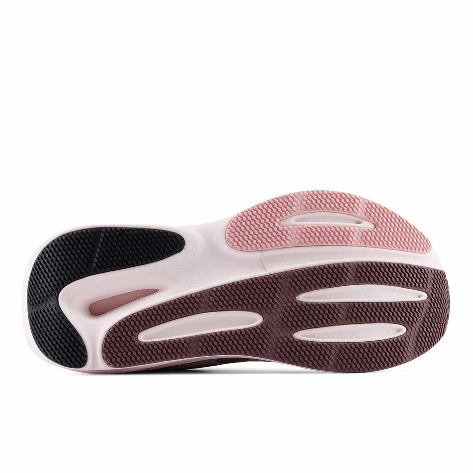 The outsole of the right shoe from a pair of New Balance Women's Fresh Foam X 860 V15 Running Shoes in the Pink Salt/Pebble colourway.
