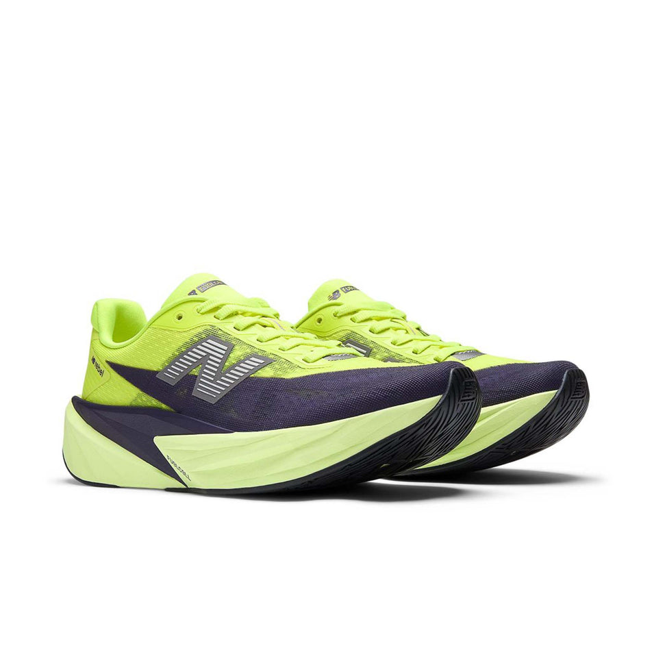 A pair of New Balance Women's Fuelcell Rebel V5 Running Shoes in the Alkaline Green/Boysenberry colourway.