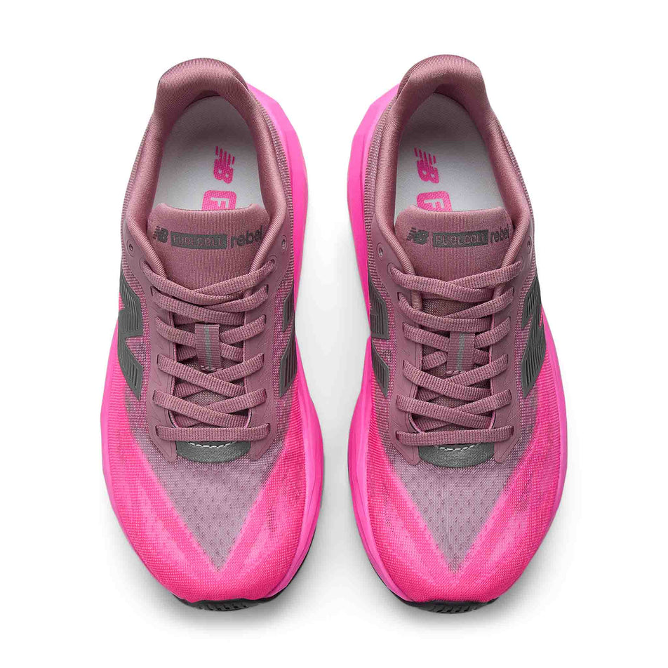 The uppers of a pair of New Balance Women's Fuelcell Rebel V5 Running Shoes in the Pink Heat/Rosewood colourway.