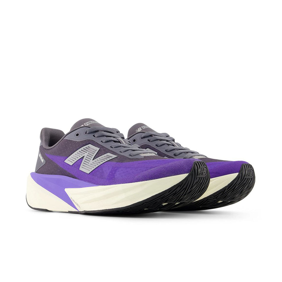 A pair of New Balance Women's Fuelcell Rebel V5 Running Shoes in the Electric Indigo/Truffle Salt colourway.