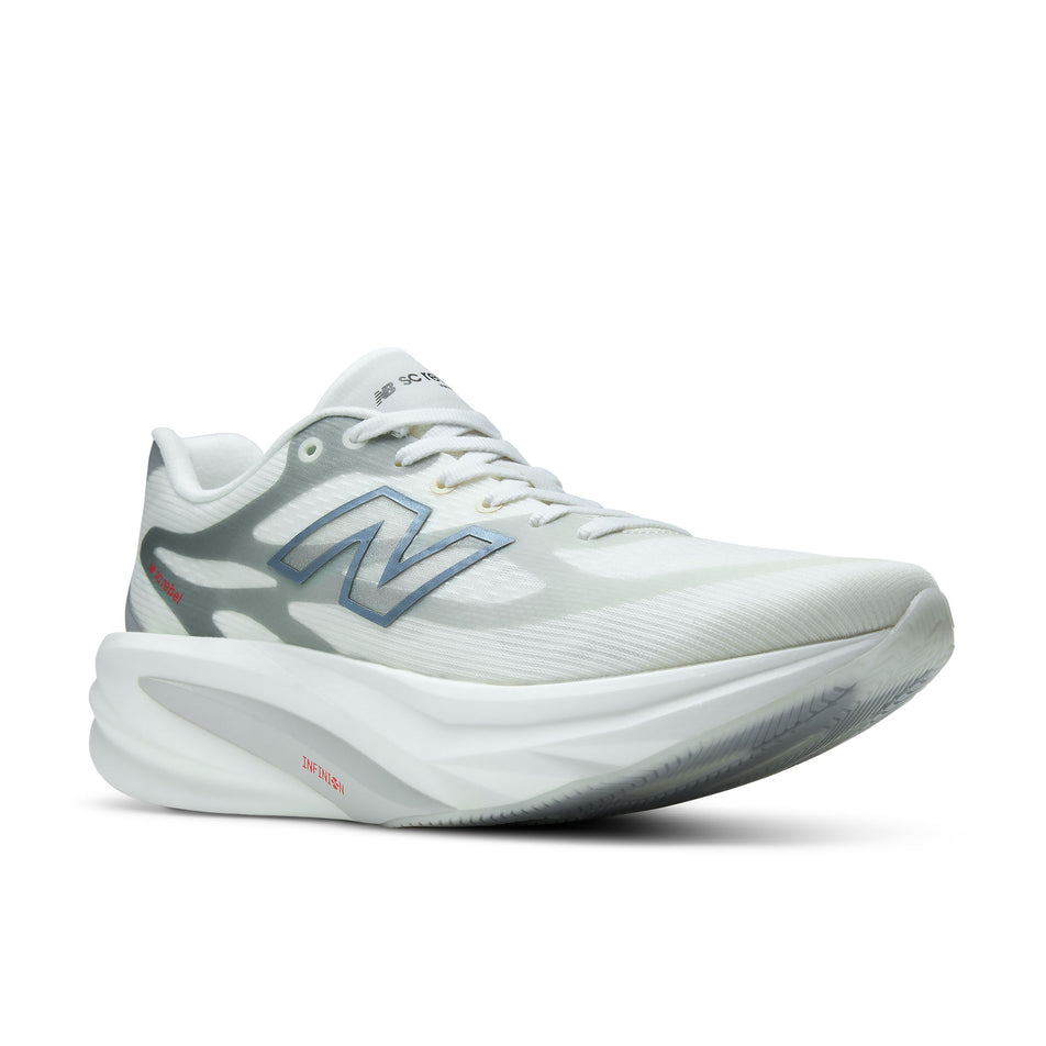 Lateral view of the right shoe from a pair of New Balance Women's SC Rebel Running Shoes in the Sea Salt/Neo Flame colourway.