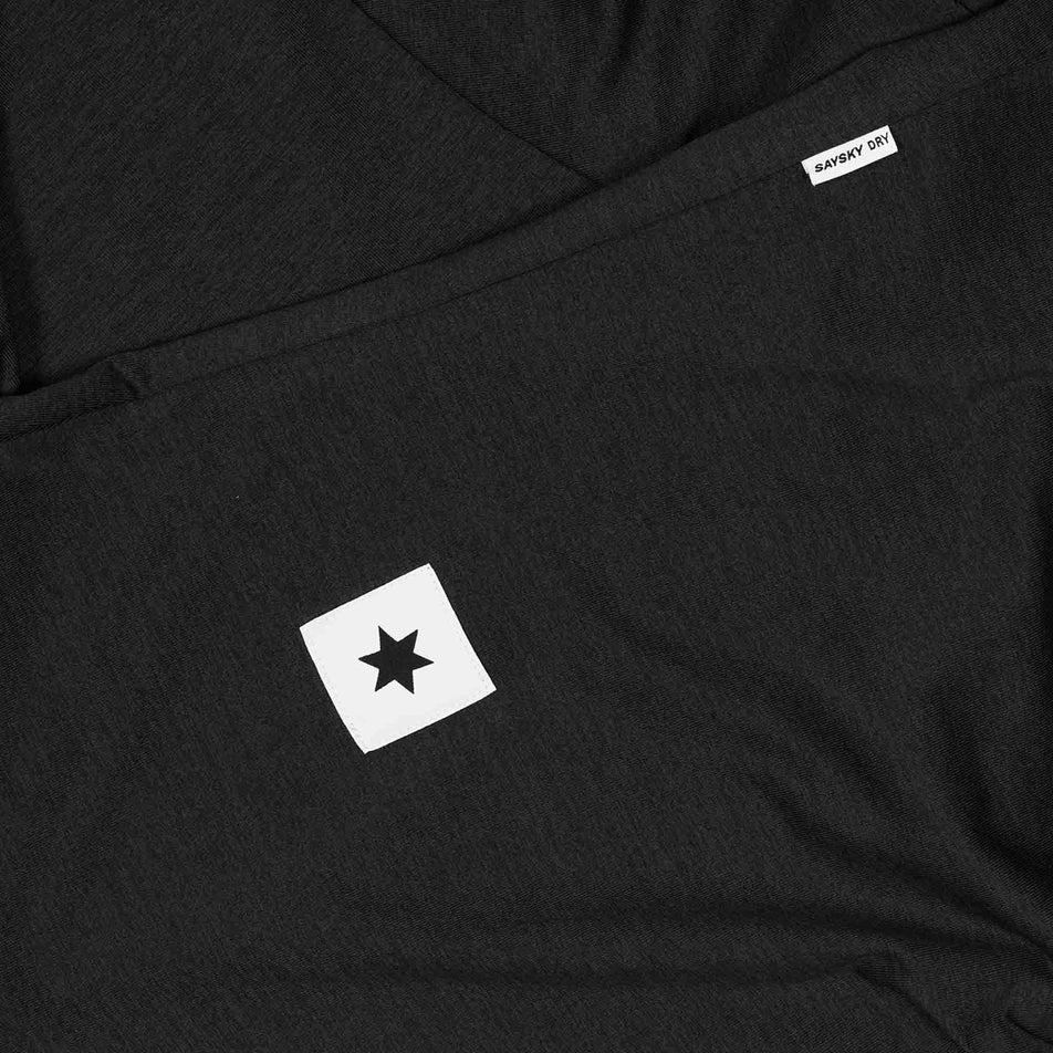 Close-up view of the SAYSKY logo on the SAYSKY Men's Clean Pace T-Shirt in the Black colourway. (8731627225250)