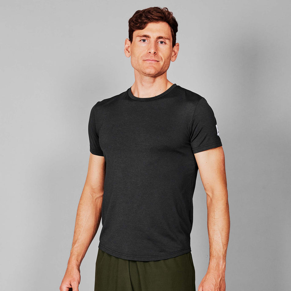 Front view of a model wearing the SAYSKY Men's Clean Pace T-Shirt in the Black colourway. (8731627225250)