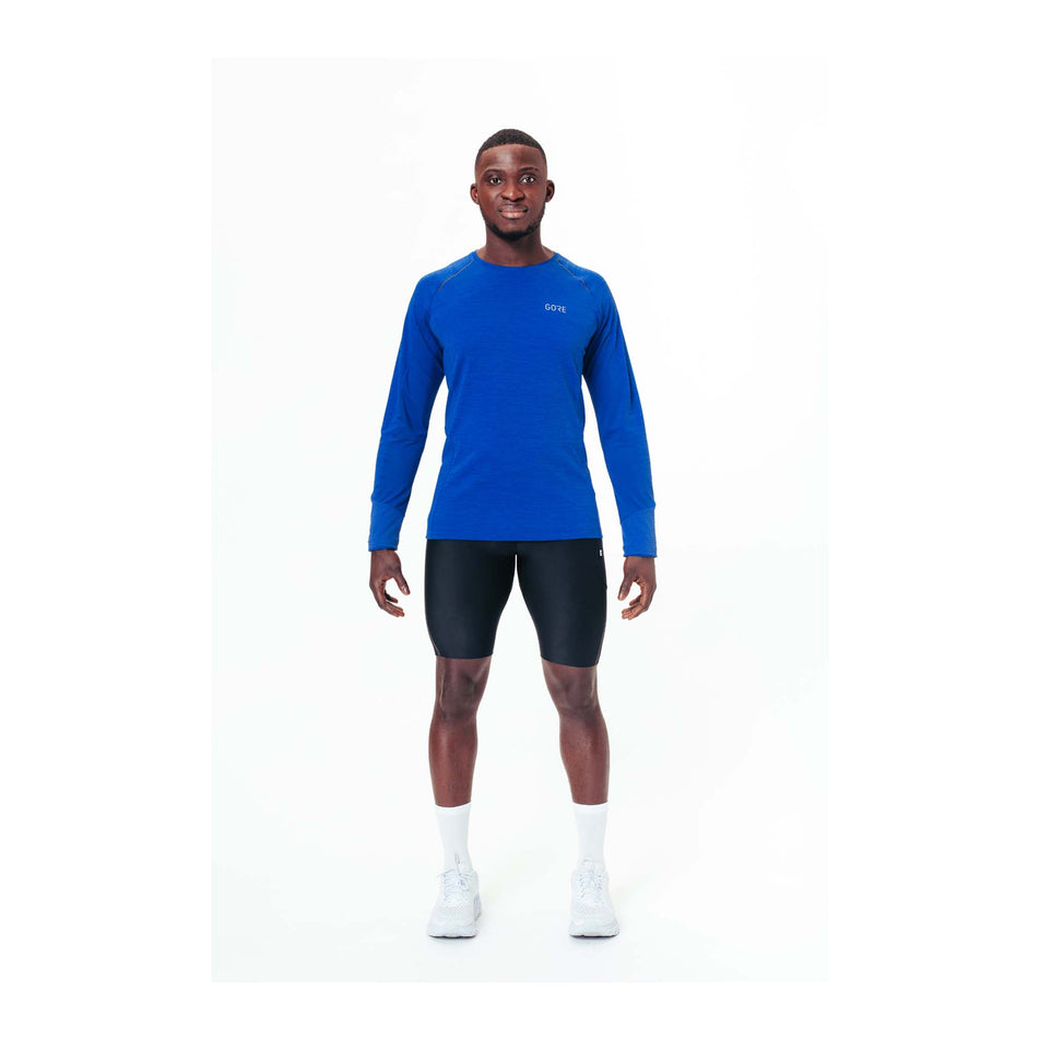 Front model view of men's gore wear energetic long sleeve shirt in blue (7518258102434)