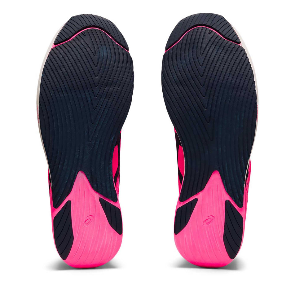 The outsole on the right and left shoes from a pair of women's Asics Metaracer (6894318846114)