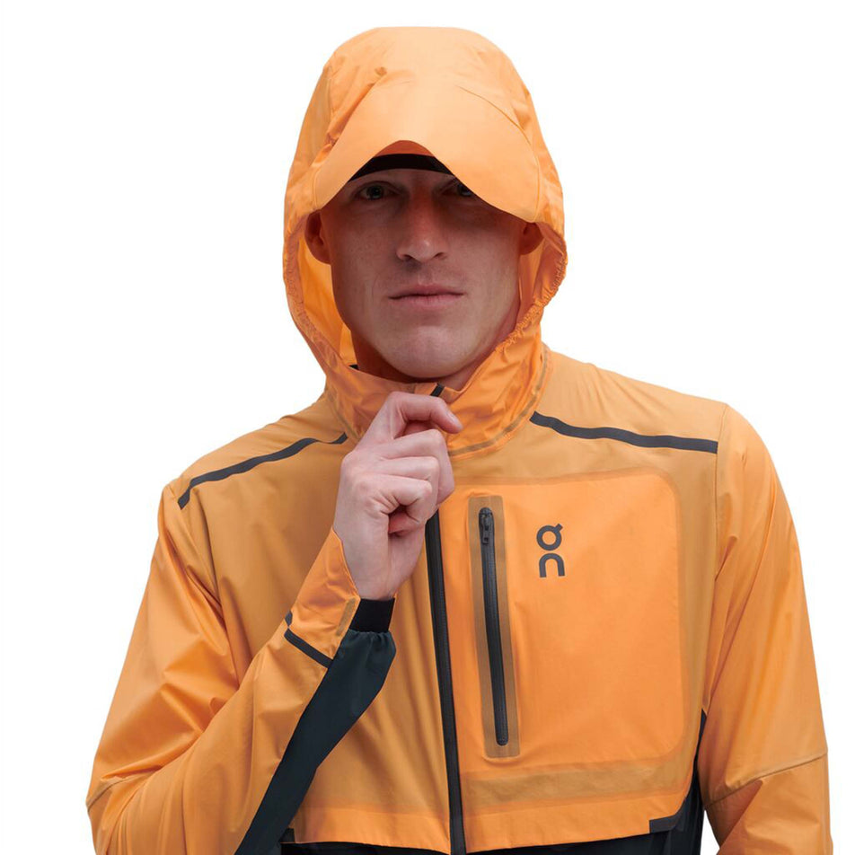 Front hood view of men's on weather jacket in orange (7518271242402)